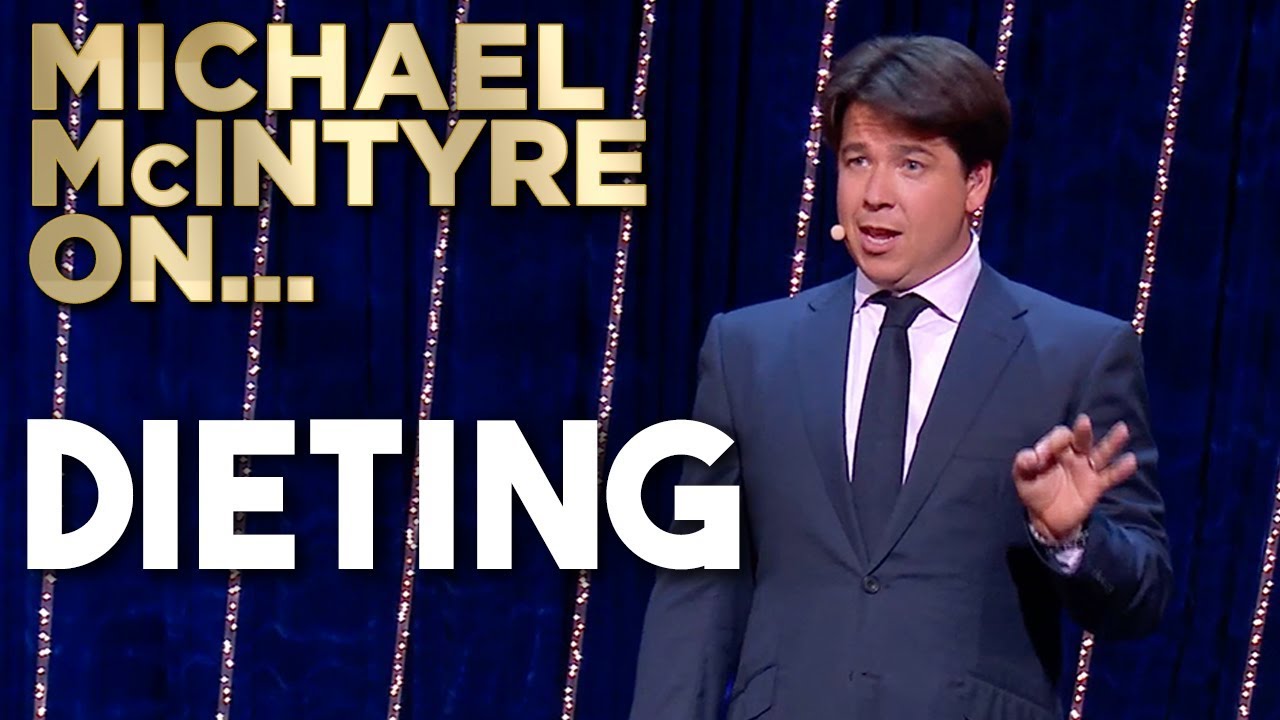 Michael McIntyre performing stand-up comedy on stage