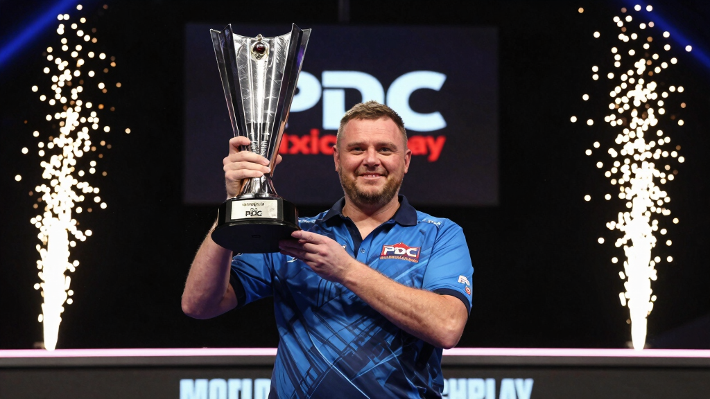 Professional darts player celebrating with trophy on stage