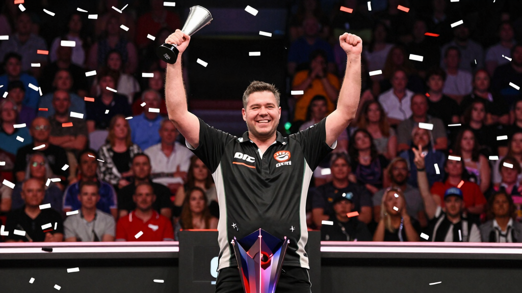 A darts player celebrating a major PDC title victory — James Wade has won 11 PDC majors