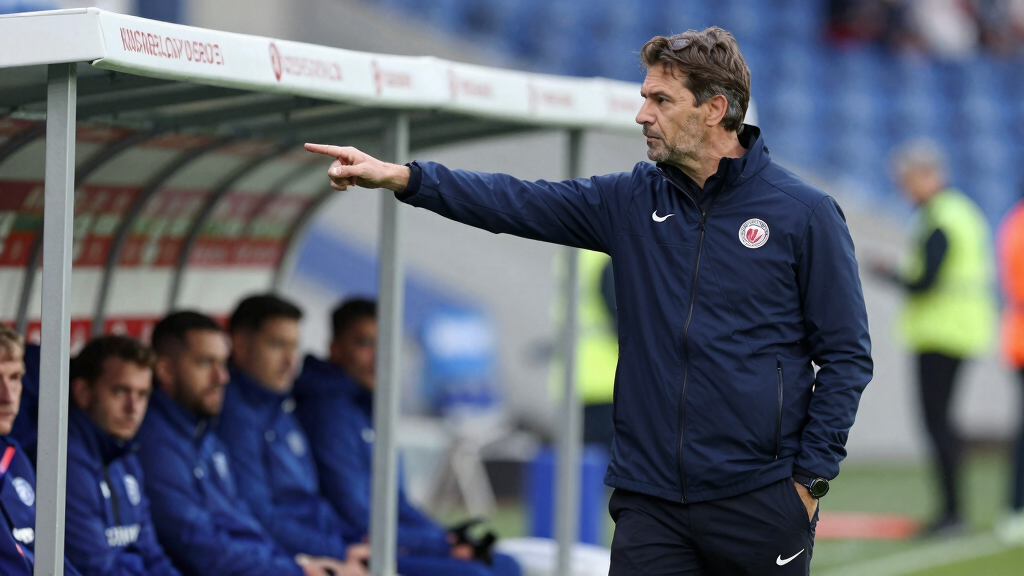 Robbie Fowler football manager on touchline