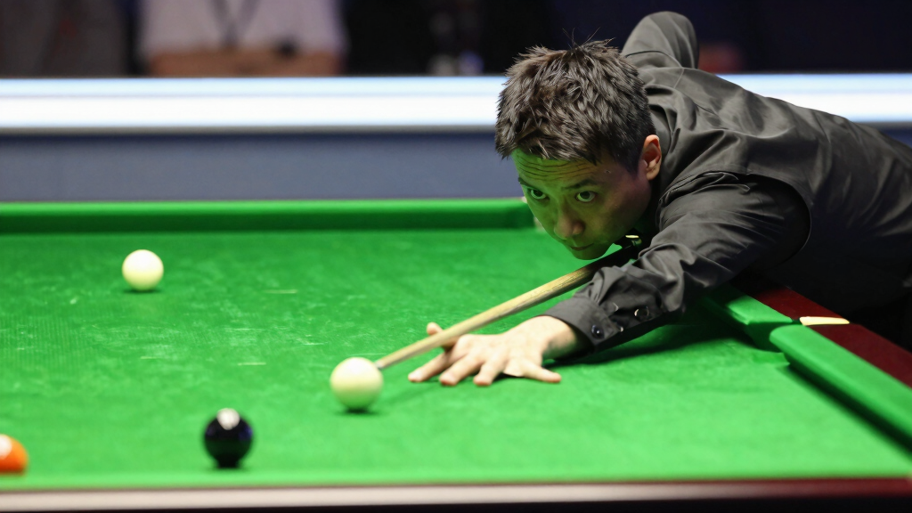 Marco Fu playing a shot at a professional snooker tournament