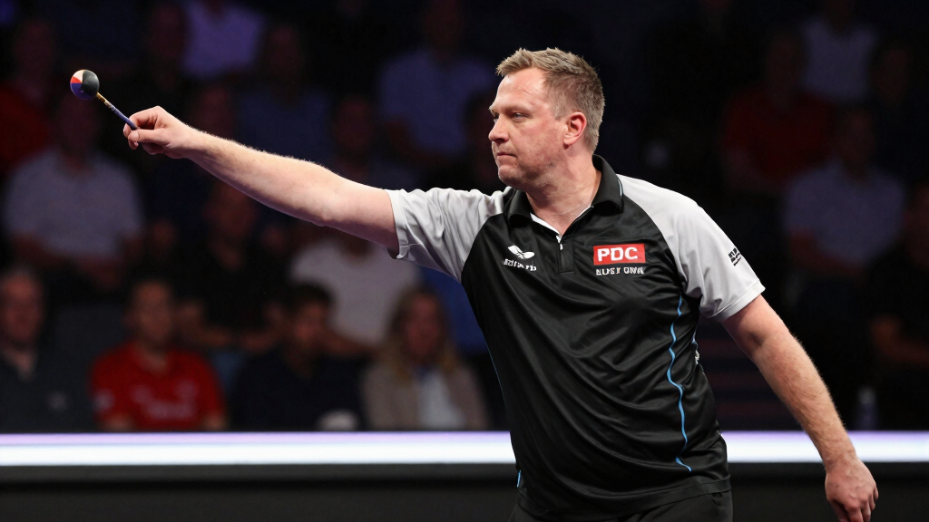 Raymond van Barneveld throwing darts at the oche during a PDC tournament