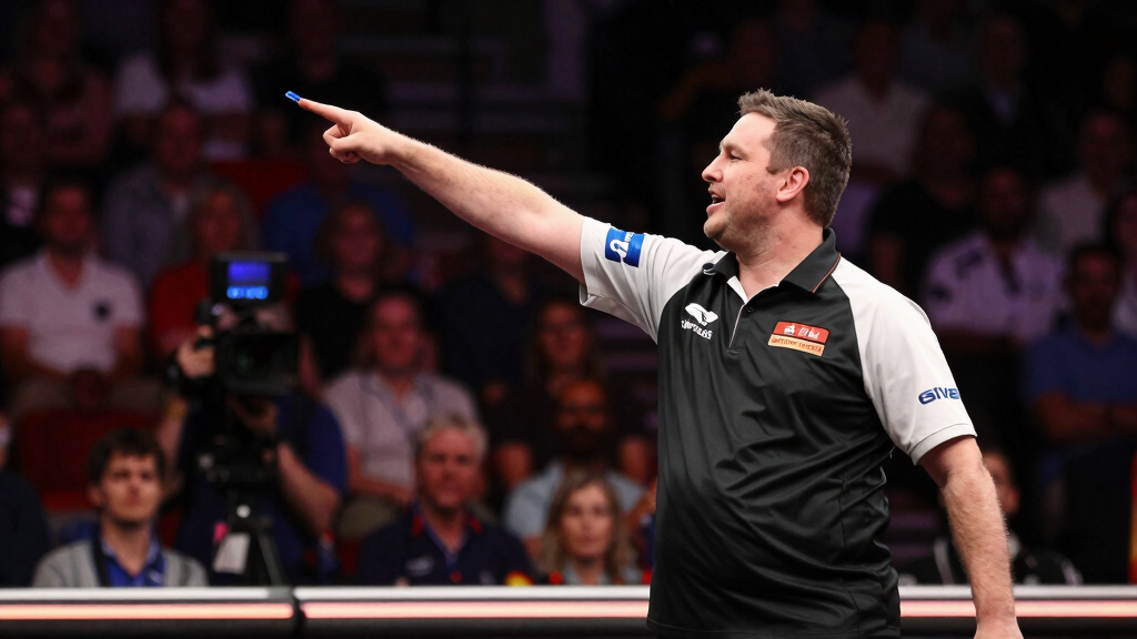 Darts player celebrating a nine-dart perfect finish, arms raised, crowd on feet