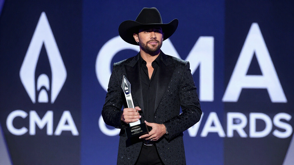Thomas Rhett at CMA Awards ceremony holding award in formal evening wear