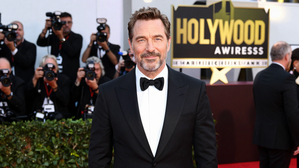 Hollywood A-list actor at film premiere red carpet photographers marquee sign
