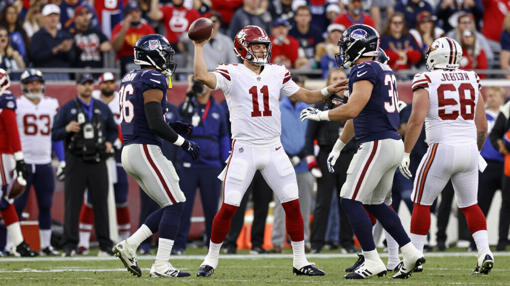 NFL quarterback being congratulated by teammates after a game-winning play football sideline celebration