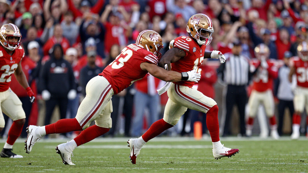 NFL running back stiff-arming a defender to break a tackle in a stadium