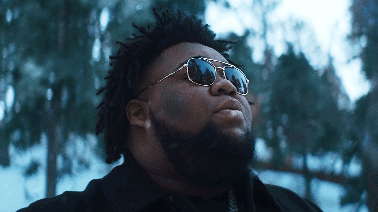 Rod Wave music video still showing the rapper's signature style and emotional performance