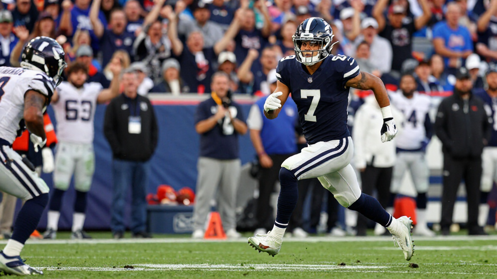 Stefon Diggs running with the ball after a catch in an NFL game