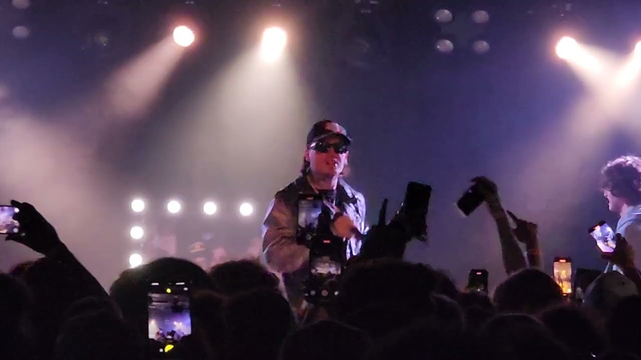Tommy Richman performing live at a concert in 2025